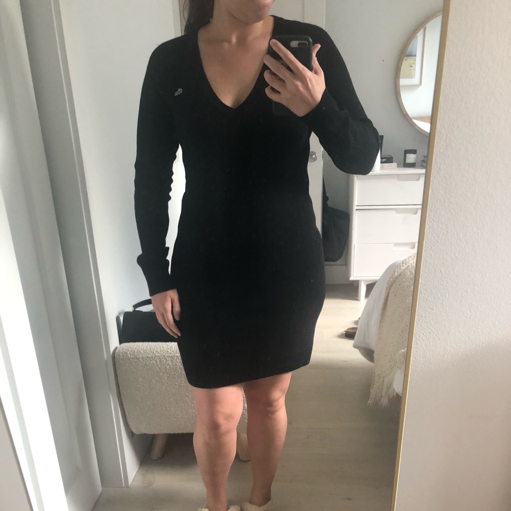 Black Lacoste sweater dress.